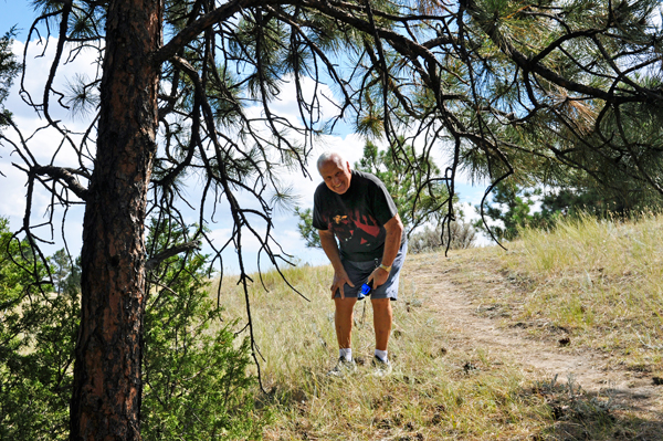 Lee Duquette framed by a tree